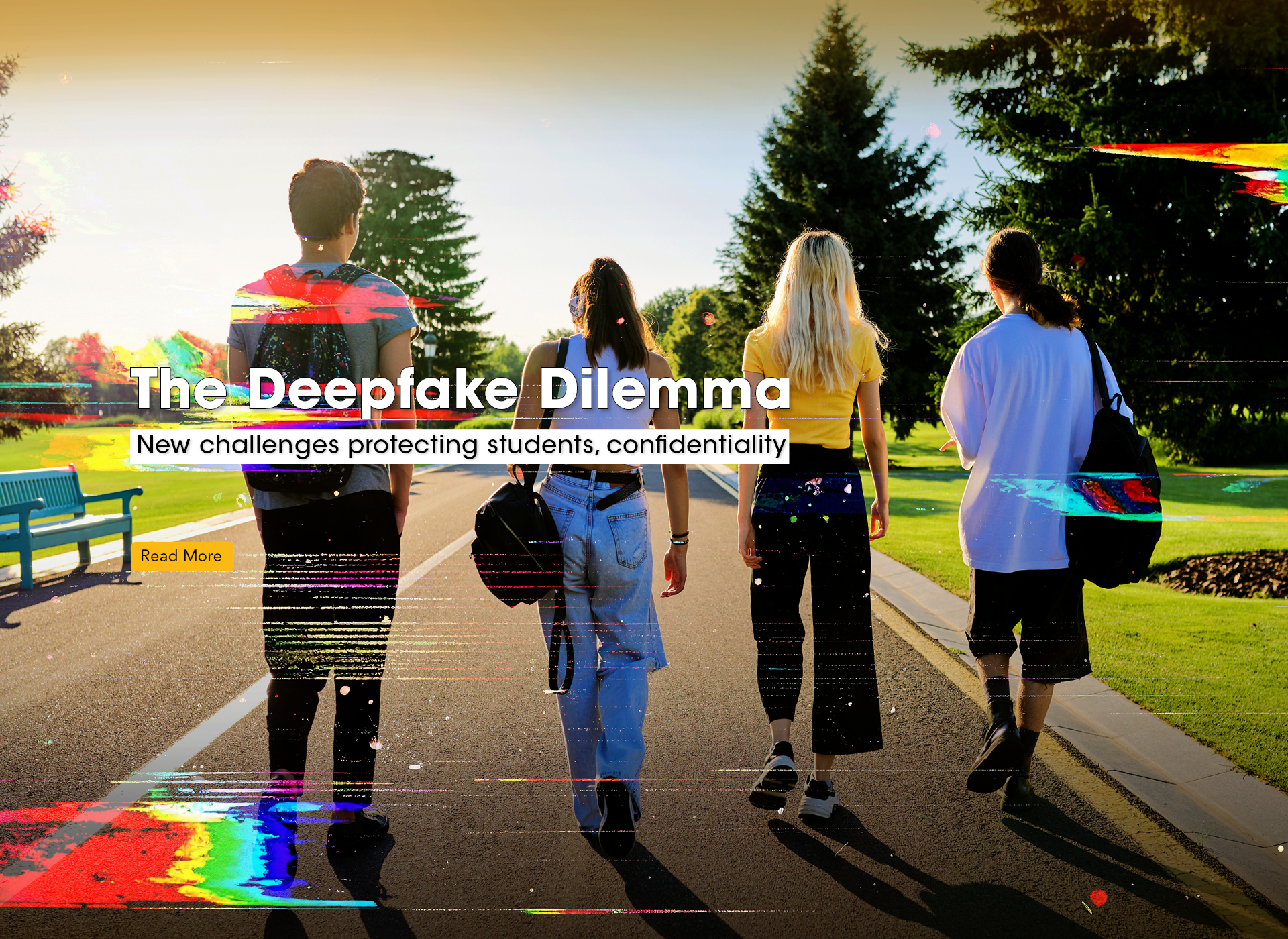 four teens with backs to camera walk down a road